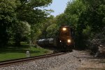 Backlit and under a high sun, CSX 2044comes west with Y106